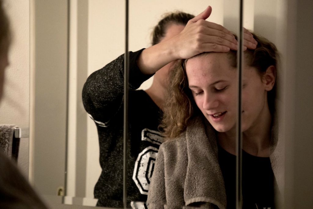 First Place, Feature Picture Story - Jessica Phelps / Newark Advocate, “Living on Love”Leah Hrebluk helps her daughter, Sophia, with her hair on the first day of 7th grade, August 21, 2019. Sophia was born weeks early and spent her first weeks of life in the NICU. Her twin brother Micheal, died and Sophia was diagnosed with Cerebral Palsy. 